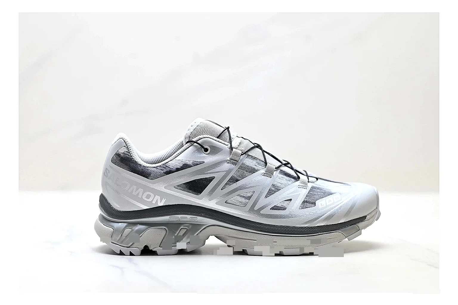 Salomon Xt Runner Silver Gray shopping brief photo showing silver gray mesh trail upper, technical runner overlays, speed-lace style structure, and rugged sole