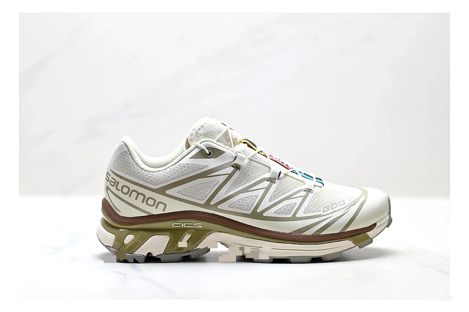 Salomon Xt Runner White Gold shopping brief photo showing white mesh trail-runner upper, gold accents, speed-lace style structure, and rugged sole